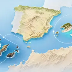 Mapa przedstawia Hiszpanię i jej wyspy: Kanary z wulkanami i czarnymi plażami, oraz Baleary z malowniczymi zatoczkami i białymi domkami.